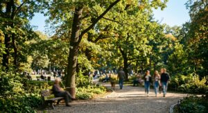 A high-quality editorial shot of a sunny afternoon in Wrocław’s Szczytnicki Park, featuring lush gre