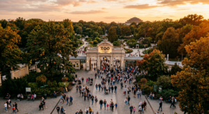 A high-angle, cinematic editorial photograph of the Wrocław Zoo entrance and surrounding greenery, c